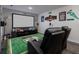 Entertainment space with a large screen, comfortable seating and sports memorabilia at 555 Meadow Bend Dr, Davenport, FL 33837