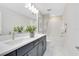Elegant bathroom featuring a double vanity, modern fixtures, and a bright, airy ambiance at 5615 Wood Bridge Pl, St Cloud, FL 34771