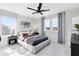 Cozy bedroom with a plush bed, airplane-themed decor, and two windows for natural light at 5615 Wood Bridge Pl, St Cloud, FL 34771