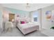 Charming bedroom featuring a plush pink bed, colorful wall accents, and bright natural light at 5615 Wood Bridge Pl, St Cloud, FL 34771