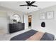Bedroom featuring dark furnishings, airplane decor, and access to an en-suite bathroom at 5615 Wood Bridge Pl, St Cloud, FL 34771