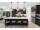 Kitchen with a large island, pendant lighting, and stainless steel appliances at 5615 Wood Bridge Pl, St Cloud, FL 34771
