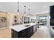 Spacious kitchen island that overlooks the dining and living spaces at 5615 Wood Bridge Pl, St Cloud, FL 34771