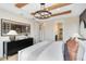 Cozy bedroom featuring wood beam ceilings, ample storage and a view into the ensuite bathroom at 5615 Wood Bridge Pl, St Cloud, FL 34771