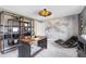 Stylish office featuring a custom wall design, modern desk, and unique bookshelf for storage and decor at 5615 Wood Bridge Pl, St Cloud, FL 34771