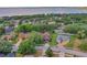 Aerial view of a lovely neighborhood showcasing well-maintained lawns, mature trees, and attractive homes at 609 Westview Dr, Minneola, FL 34715