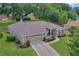 Aerial view of a well-maintained home featuring an attached garage at 609 Westview Dr, Minneola, FL 34715