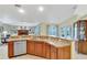 Well-equipped kitchen with a breakfast bar, stainless steel appliances, and open access to other rooms at 609 Westview Dr, Minneola, FL 34715