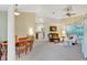 Open-concept living space with connecting dining area and comfortable furnishings at 609 Westview Dr, Minneola, FL 34715