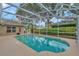 A sparkling screened-in pool surrounded by lush landscaping, great for outdoor living at 609 Westview Dr, Minneola, FL 34715