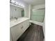 Modern bathroom featuring a sleek vanity, updated fixtures, and a glass-enclosed shower at 6328 Raleigh St # 816, Orlando, FL 32835