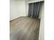 Bright bedroom featuring wood floors and ample space at 6328 Raleigh St # 816, Orlando, FL 32835