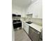 Well-appointed kitchen with stainless steel appliances and ample counter space at 6328 Raleigh St # 816, Orlando, FL 32835