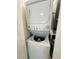 Convenient laundry area equipped with a stacked washer and dryer unit at 6328 Raleigh St # 816, Orlando, FL 32835