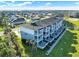 Scenic aerial view of a condo community with lush landscaping and private balconies at 7 Marden Dr, Ormond Beach, FL 32176