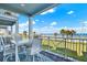 Charming balcony featuring a dining set, perfect for enjoying meals with a scenic ocean backdrop at 7 Marden Dr, Ormond Beach, FL 32176