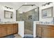 Modern bathroom featuring double vanities, framed mirrors, and a glass-enclosed shower at 7 Marden Dr, Ormond Beach, FL 32176