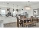 Dining area with modern chandelier, a table and view into the kitchen at 7 Marden Dr, Ormond Beach, FL 32176