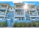 Beautiful light-blue exterior with white trim and multiple balconies offering stunning views at 7 Marden Dr, Ormond Beach, FL 32176