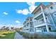 Beautiful light-blue exterior with white trim and multiple balconies near the beach at 7 Marden Dr, Ormond Beach, FL 32176