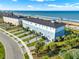 Stunning oceanfront townhomes feature stylish exteriors, manicured lawns, and convenient access to the beach at 7 Marden Dr, Ormond Beach, FL 32176