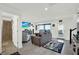 Bright living room with tile flooring, ocean views, and a neutral-colored sofa at 7 Marden Dr, Ormond Beach, FL 32176