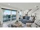 Comfortable living room featuring a couch, ocean views and access to outdoor patio at 7 Marden Dr, Ormond Beach, FL 32176