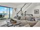 Living room featuring stairs, ocean views, and comfortable seating at 7 Marden Dr, Ormond Beach, FL 32176