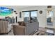 Bright living room with ocean views, a neutral-colored sofa, and beach decor at 7 Marden Dr, Ormond Beach, FL 32176