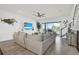 Spacious living room with stairs and ocean views from the balcony at 7 Marden Dr, Ormond Beach, FL 32176