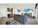 Cozy living room features a gray sofa, bar area, and coastal-themed decorations at 7 Marden Dr, Ormond Beach, FL 32176