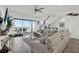 Bright living room features coastal decor and ocean views from the sliding glass doors at 7 Marden Dr, Ormond Beach, FL 32176