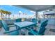 Beautiful light-blue patio set on a lovely covered patio with a view of the ocean at 7 Marden Dr, Ormond Beach, FL 32176