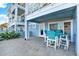 View of a covered outdoor patio area with ocean views and outdoor seating at 7 Marden Dr, Ormond Beach, FL 32176