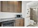 Convenient wet bar with custom cabinets and a wine fridge enhances the home at 7 Marden Dr, Ormond Beach, FL 32176