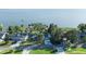 Waterfront property with a private dock and lush landscaping situated on a serene lake at 7046 Treasure Island Rd, Leesburg, FL 34788