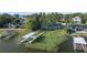 Waterfront home featuring multiple docks and beautiful views of the lake at 7046 Treasure Island Rd, Leesburg, FL 34788