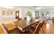 Charming dining room with hardwood floors, modern lighting, and an inviting atmosphere for Gathering meals at 7046 Treasure Island Rd, Leesburg, FL 34788