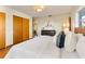 Comfortable main bedroom with hardwood floors, a spacious closet, and a calm atmosphere for restful nights at 7046 Treasure Island Rd, Leesburg, FL 34788