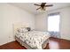 Comfortable bedroom featuring a full-size bed and a window with curtains at 7407 Country Run Pkwy, Orlando, FL 32818
