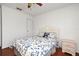 Cozy bedroom featuring a full-size bed and a nightstand with drawers at 7407 Country Run Pkwy, Orlando, FL 32818