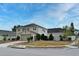 Corner lot residence shows the spacious front yard and driveway and lush landscaping at 7407 Country Run Pkwy, Orlando, FL 32818