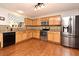 Well-equipped kitchen with stainless steel appliances and granite countertops at 7407 Country Run Pkwy, Orlando, FL 32818
