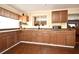 Kitchen with wood cabinets and granite countertops at 7407 Country Run Pkwy, Orlando, FL 32818