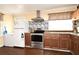 Kitchen featuring stainless steel appliances and ample counter space at 7407 Country Run Pkwy, Orlando, FL 32818