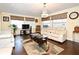 Cozy living room with large windows, a comfortable sofa, and stylish decor at 7407 Country Run Pkwy, Orlando, FL 32818