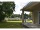 Relaxing covered patio offering stunning lake views and outdoor seating at 7508 Lake Marsha Dr, Orlando, FL 32819