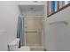Bathroom featuring enclosed shower with gray curtain at 8004 Village Green Rd, Orlando, FL 32818