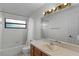 Bathroom with tub-shower combo and vanity with good lighting at 8004 Village Green Rd, Orlando, FL 32818