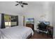 Comfortable bedroom with backyard access and an ensuite bathroom at 8004 Village Green Rd, Orlando, FL 32818
